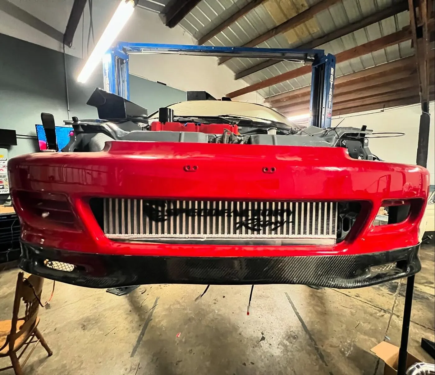 Project car up on the lift in the Spearmint Dyno bay