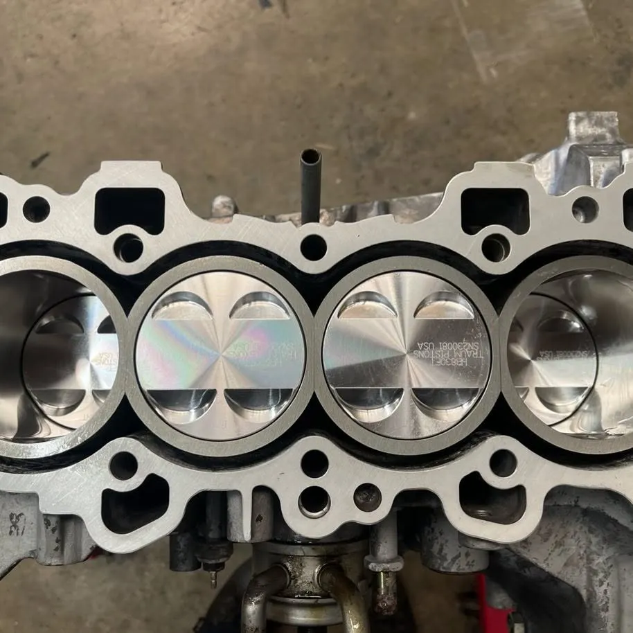 Short block assembly with pistons installed